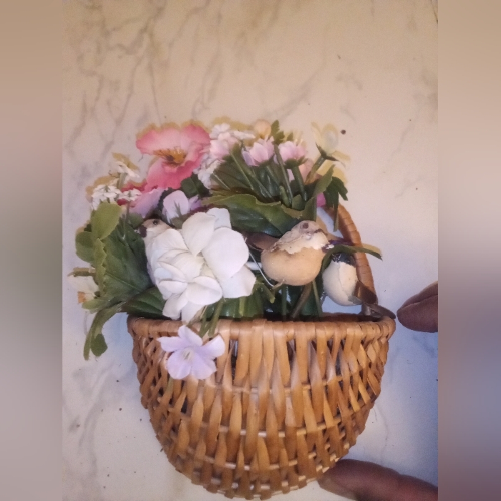 Wicker basket with flowers and birds